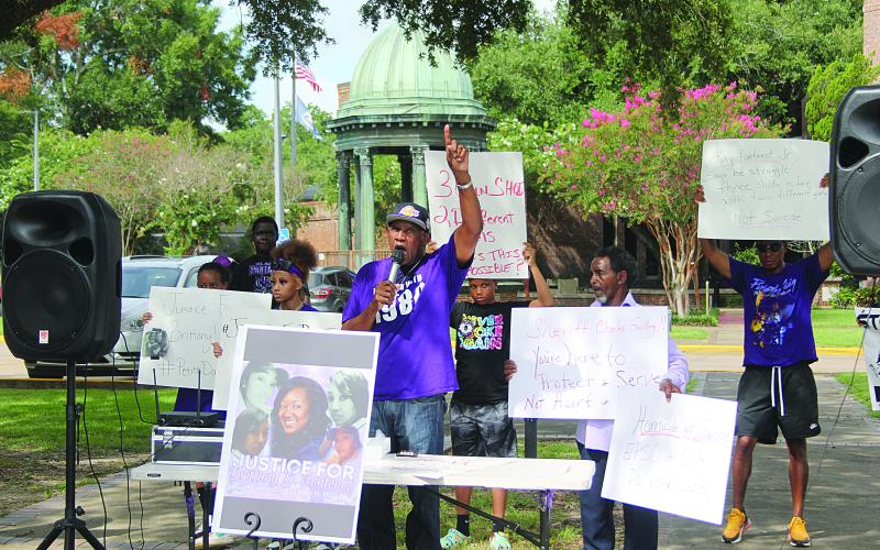 JULY 16 - Family members and friends of Brittany Fontenot are pictured as they gather for a peaceful protest at the courthouse. In the center is Hamilton Frank, an uncle of the victim. (Gazette photo by Tony Marks)