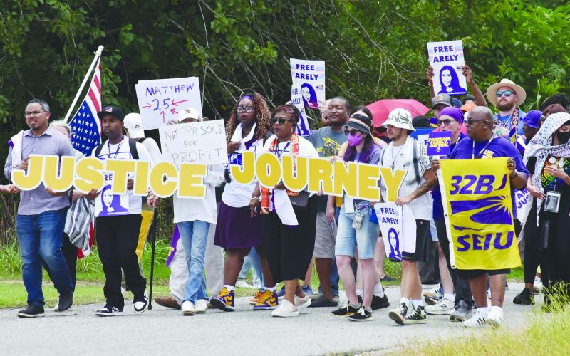 Protesters gather outside the GEO South Louisiana Detention Center in Basile on Monday, June 30. Among them were Joseph Bryant, international executive director of Service Employees International Union (SEIU).   (Photo by Robert Stewart of Verite News)