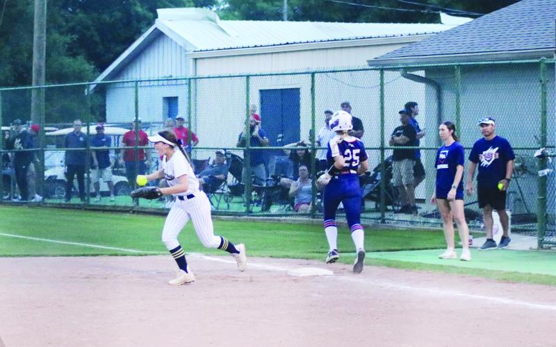 Lady Trojan first baseman Kali Shiver (22) celebrates after recording the final out of the game against Riverside Academy in the quarterfinal round of the state softball playoffs. (Gazette photo by Tony Marks)