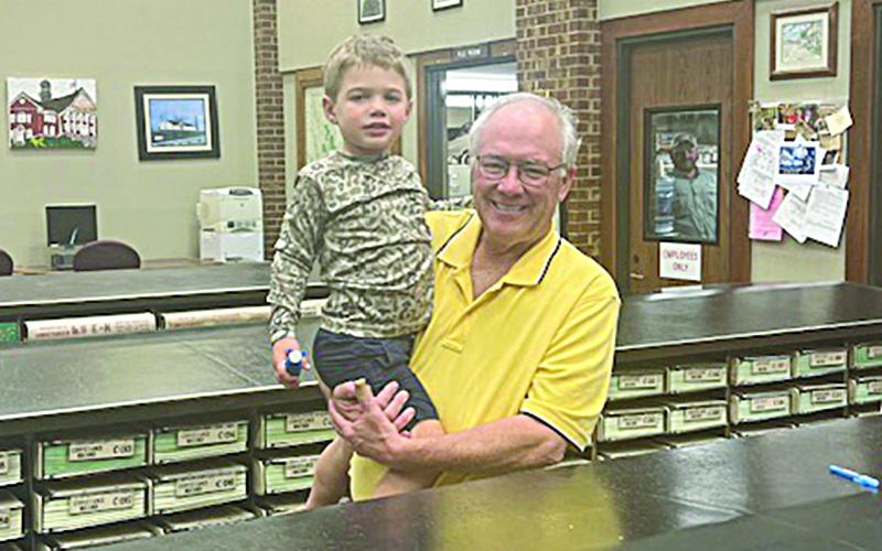Evangeline Parish Clerk of Court Randy Deshotel celebrates his election night victory with his grandson, Stetson Fontenot. (Gazette photo by Tony Marks)