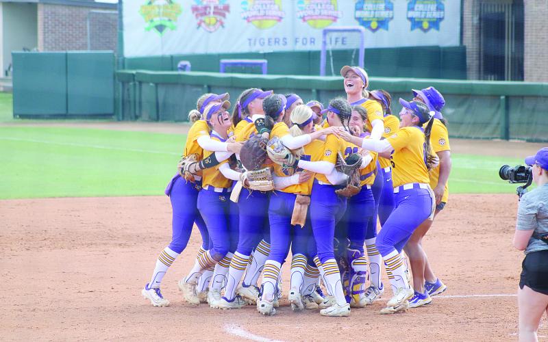 Members of the LSU softball team celebrate inside the pitching circle after the final out was recorded in Sunday’s run-rule win against Southern Illinois. (LSN photo by Tony Marks)