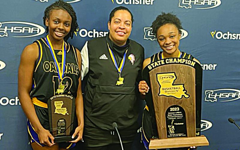 From left are Most Outstanding Player Emani Young, Oakdale girls basketball head coach and Ville Platte native Renotta Edwards, and Kaylee Bradley. (LSN photo by Tony Marks)