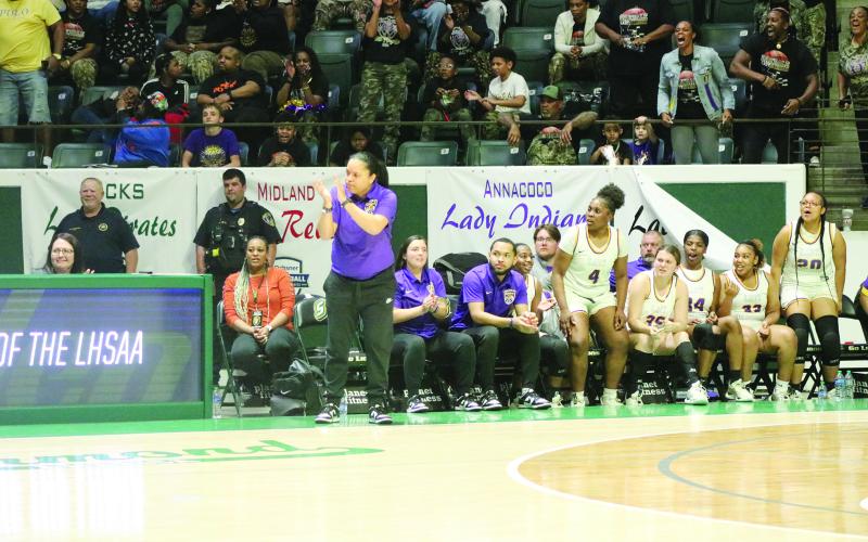Sacred Heart head girls’ basketball coach Craig Whittington (left photo) and Oakdale head girls’ basketball coach Renotta Edwards (right photo) are pictured during their respective teams’ appearances in the semifinals of the LHSAA Girls’ Marsh Madness. (Gazette photos by Tony Marks)