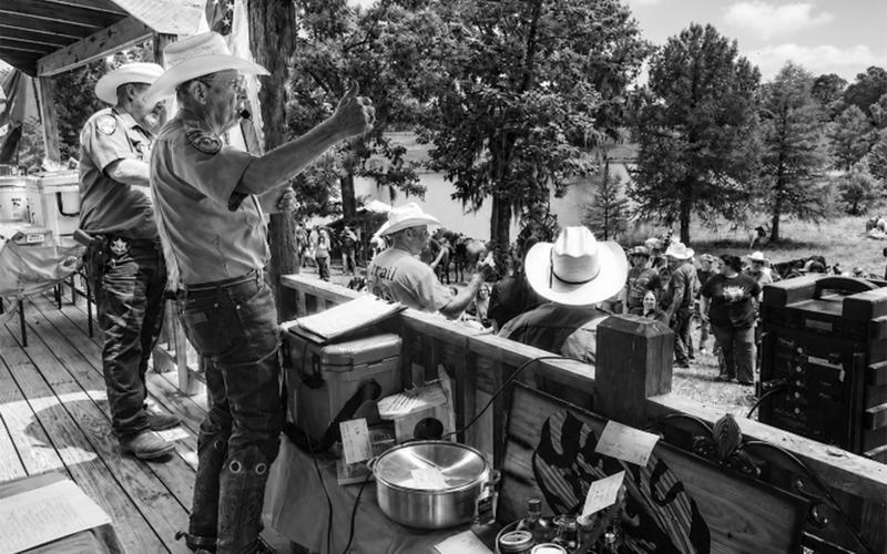 Colonel Ricky Duhon of Basile, a member of the Evangeline Parish Sheriff’s Posse serves as auctioneer at the annual St. Jude Trail Ride.