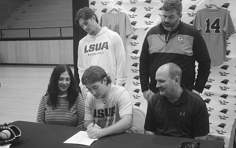 Riley Fontenot (seated in the center) is pictured as he signs with LSUA. Also pictured are: seated (from left) Shelly Fontenot and Ted Fontenot; standing (from left) Cayden McCollough and Dylan Manuel. (Gazette photo by Tony Marks