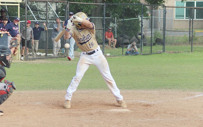 Sacred Heart catcher and two-hole hitter Blake Hebert (15) backs away from the plate as a pitch sails inside in the Trojans’ home playoff loss to Riverside Academy. (Gazette photo by Rhett Manuel)