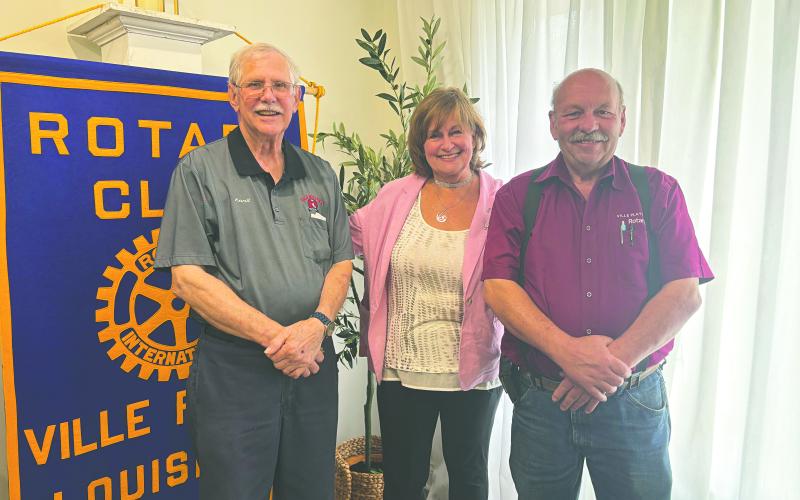 LANDRY SHARES FATHER’S STORY - Author Madelaine Landry addressed the June 10, meeting of the Ville Platte Rotary Club about her new book “Caro Giovanni” (Dear John). She is shown with Rotarian Kermit Miller (left) and Rotary President Bob Manuel (right). (Gazette photo by Heather Bogard)