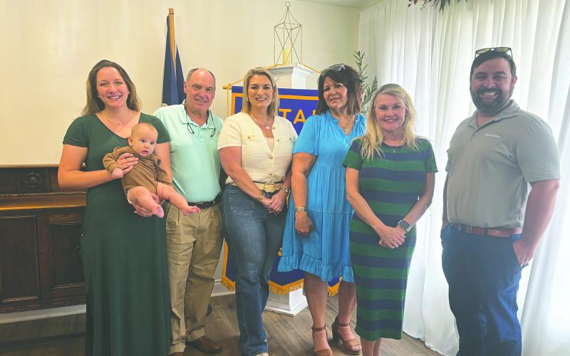ECONOMIC DEVELOPMENT BOARD VISITS ROTARY - From left are Evangeline Parish Economic Development Board leaders Raquel Manuel (holding her son, Connor), Eric Fontenot, Krista Vidrine, Liz Chatelain, Opal Andrus and Rotary President Beau Wilson.  (Gazette photo by Heather Bogard)