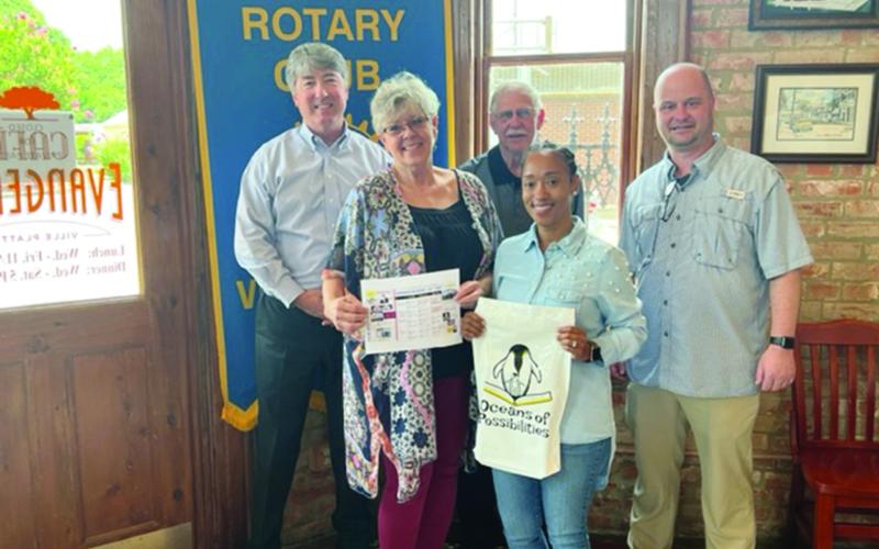 Pictured from left are: back row- Rotary President Jimmy LeBlanc, Rotarian Kermit Miller, and Evangeline Parish Library Director Dr. William Holmes; front row- Library Outreach Director Suzy Lemoine, and Outreach employee Keisha Ford. (Gazette photo by Tony Marks)