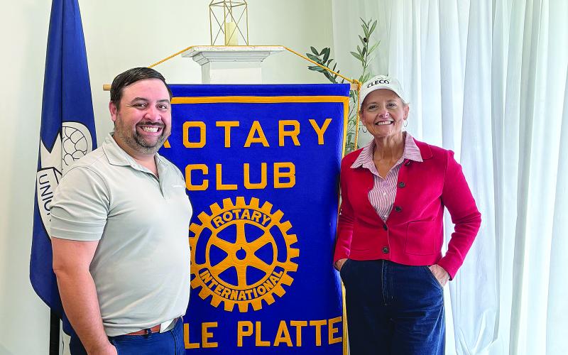 Rotary Club of Ville Platte speaker on Tuesday, July 1, and guest of Steve Phillips a Rotorian, was Sabrina Salling, government services representative of Cleco. Salling is pictured on the right with Rotary president Beau Wilson. (Gazette photo by Tony Marks)
