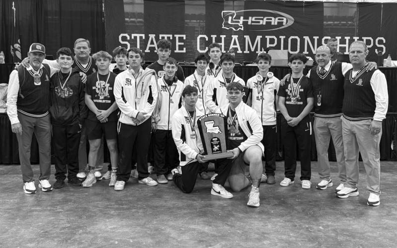Pictured in the left photo are the Sacred Heart boys who finished as state runner-up in powerlifting. Among them are Liam Kincanon, Gavin Patin, Sam LaFleur, Andre Morein, Evan Huffman, Landon Fontenot, Houston Daigle, Ty Pepiton, Luke Vidrine, and JD LaHaye.