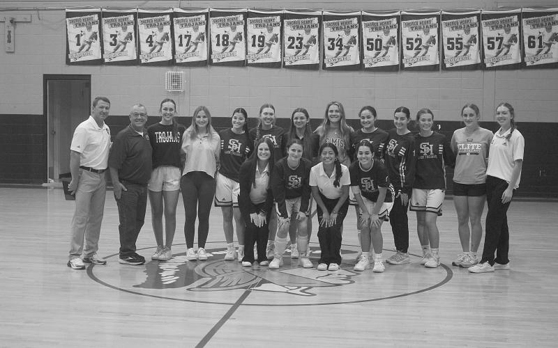 Last year’s Sacred Heart girls’ basketball team was honored prior to a scrimmage on Thursday, November 7. Pictured in no particular order are head coach Shane Darbonne, former head coach Craig Whittington, Bre Ardoin, Laura Prudhomme, Averie Pitre, Josie Vidrine, Mary Perron, Alyssa Brignac, Caroline Richardson, Jolie Vidrine, Rose Ardoin, Taylor Darbonne, Jodie Landry, Ava Johnson, Olivia Tate, Emily Ardoin, and Katherine Fontenot. Not pictured is Kali Shiver. Gazette photo by Tony Marks