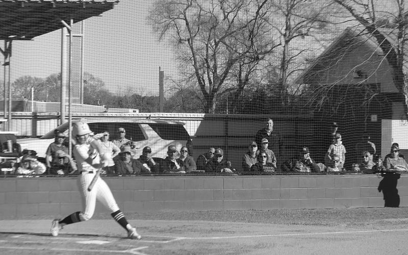 Catherine Larson connects with a pitch for a home run in Sacred Heart’s win over Pine Prairie. (Gazette photo by Rhett Manuel)
