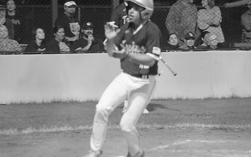 Isaac Perry (22) claps his hands after crossing the plate for Sacred Heart’s first run in a 6-2 win against Pine Prairie on Tuesday, March 5. (Gazette photo by Tony Marks)