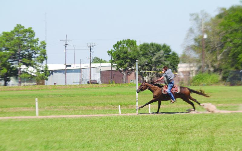 Brandon Snoke is pictured as he attempts to collect a ring during qualifications for the Louisiana Tournoi on Sunday, September 10. (Gazette photo by Tony Marks)