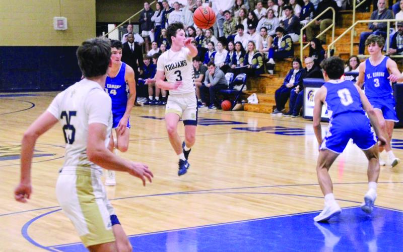 Ellis Chapman (3) passes the ball to a Trojan teammate in Sacred Heart’s 59-34 win over St. Edmund last Friday night. (LSN photo by Rhett Manuel)