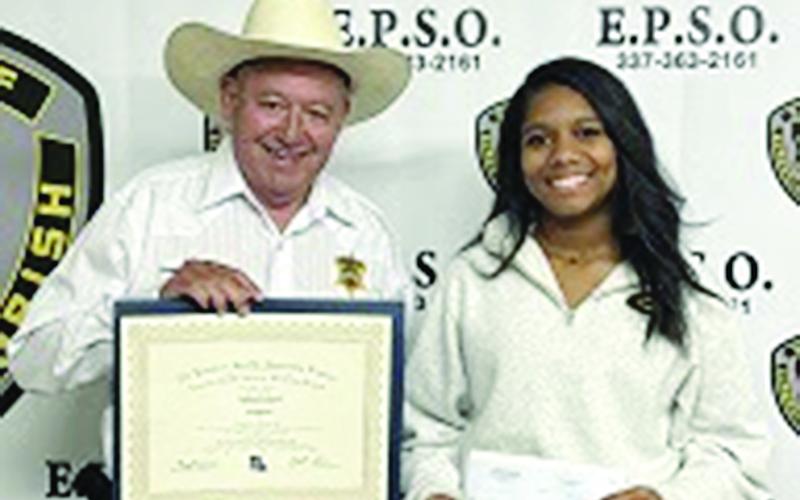 Evangeline Parish Sheriff Charles Guillory is pictured on the left as he presents an academic scholarship to Jaidan Richard, of Mamou. (Photo courtesy of EPSO)