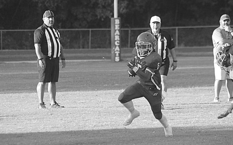 Basile’s Bryan Hardy (5) finds a running lane in the scrimmage Thursday night. (Gazette photo by Rhett Manuel)