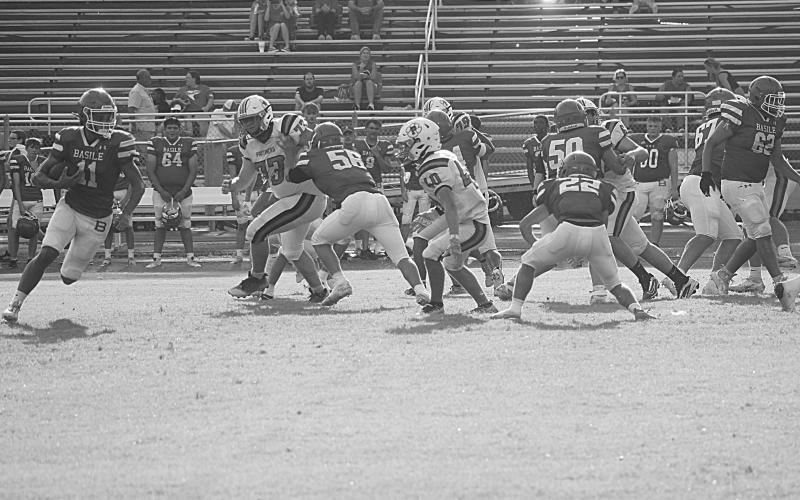 Landon Istre (11) looks to find some running room for his Basile Bearcats in the scrimmage against Pine Prairie. (Gazette photo by Tony Marks)
