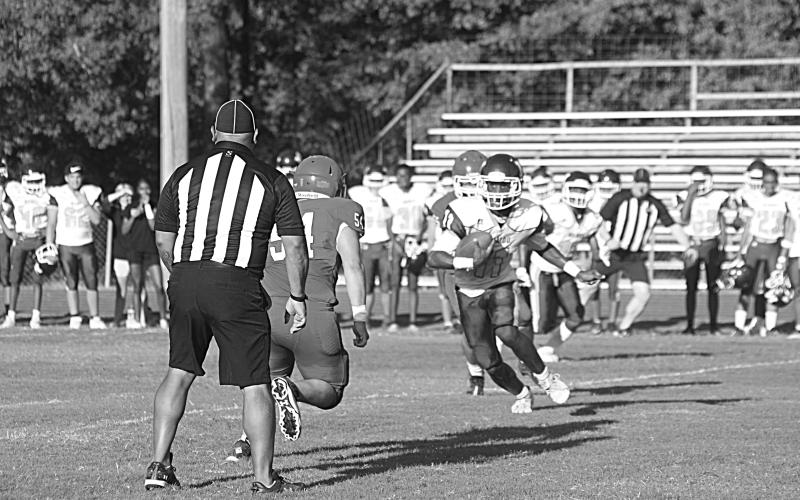 Mamou’s Zeric Weston looks to turn a corner and pick up positive yards in the scrimmage against Basile. (Gazette photo by Rhett Manuel)