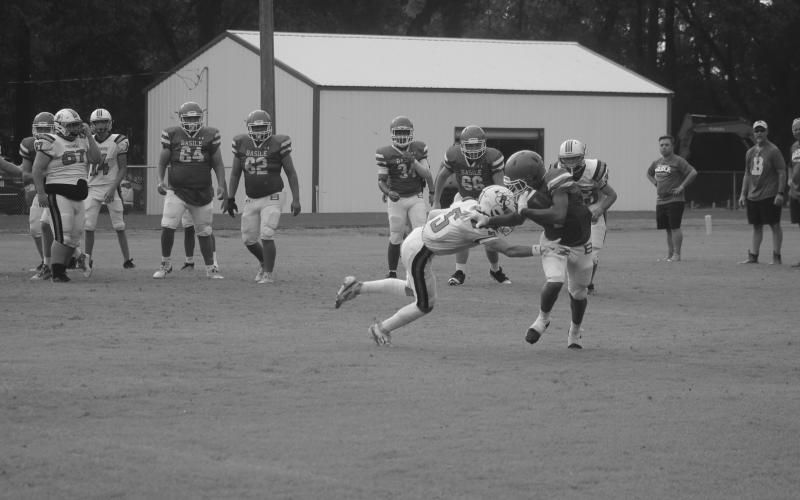 Jacob Carroll (5) looks to make a tackle against a Basile runner in the scrimmage on Thursday night. (Gazette photo by Tony Marks)