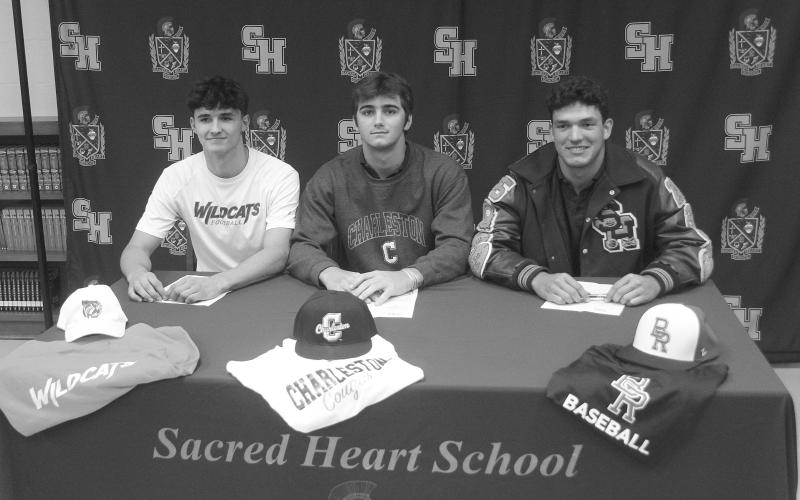 From left are Ethan Karonika (signed with Louisiana Christian University), Zeph Arnold (signed with College of Charleston), and Isaac Leger (signed with Baton Rouge Community College. (Gazette photo by Tony Marks)