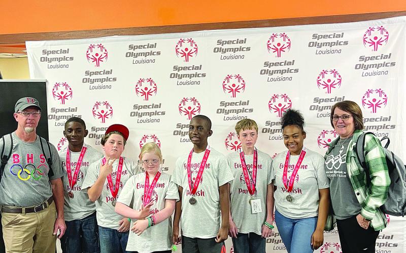 From left are Coach Chad Lafleur, Christopher Louis, Christopher Bergeron, Aubrey LaHaye, Noah Fontenot, Colby Lasage, Montashia Attle, and Coach Valerie Fontenot. Not pictured is Dane Thibodeaux. (Photo courtesy of Tommy Jones)
