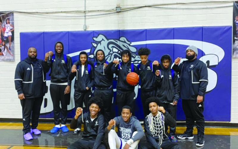 Pictured with their coaches are members of the Ville Platte High boys’ basketball team that won the District 5-3A championship. In no particular order are Davonte Fontenot, Jaquan Lavergne, Jamarre Byers, Tauj Roy, Montavius Seraille, Taylin Richard, Jakhalan Slaughter, Troas Murray, Latelldrick Prejean, Sage Papillion, Michael Berry, and Latrayvion Thomas. (Photo courtesy of VPHS)
