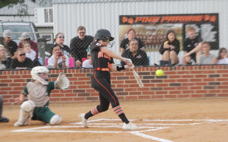 Sydney Fontenot (20) connects with a pitch in a Pine Prairie Lady Panther game against Mamou. (Gazette photo by Rhett Manuel)