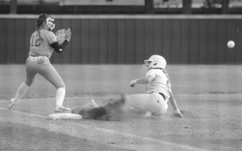 Ellie Wilmouth (4) slides in safely to third base ahead of the throw from a St. Frederick fielder in Sacred Heart’s 10-8 quarterfinal loss last Friday. (Gazette photo by Tony Marks)