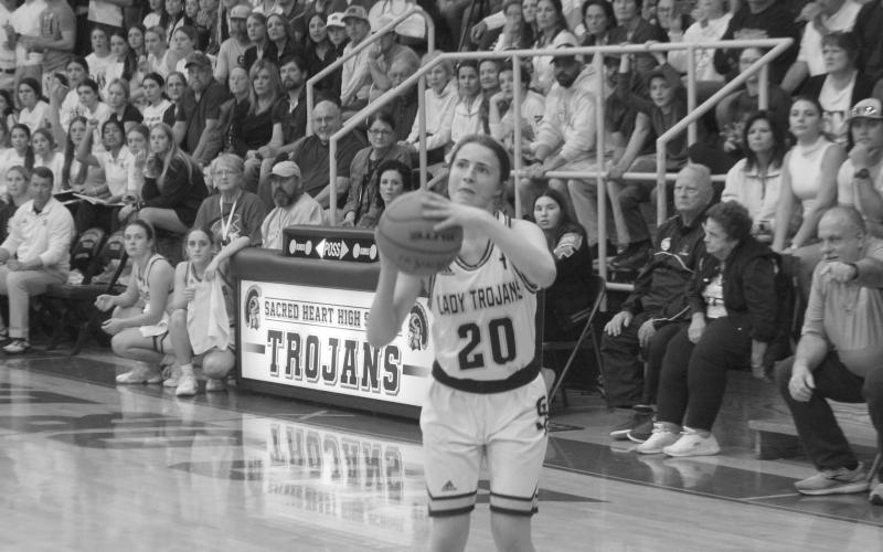 Alyssa Brignac (20) attempts to make a basket in Sacred Heart’s quarterfinal win on Thursday night. (Gazette photos by Rhett Manuel)