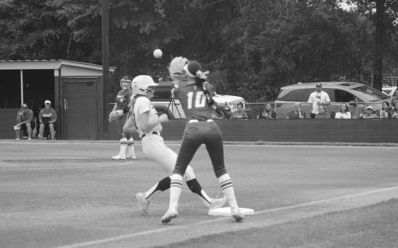 Maci Droddy (77) safely reaches third base ahead of the throw in Sacred Heart’s win over St. Mary’s. (Gazette photo by Tony Marks)