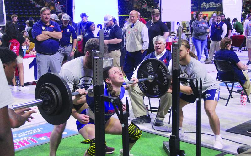 Pictured on the left is Sacred Heart’s Lily Deshotel as she squats on Thursday. (Gazette photo by Tony Marks)
