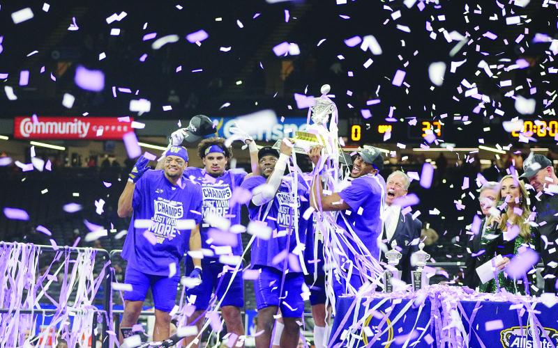 This photo of Offensive MVP Michael Penix Jr. along with Defensive MVP Bralen Trice and other members of the Washington Huskies hoisting the Allstate Sugar Trophy earned 1st place in Best Sports Photo. (Gazette photos by Tony Marks)