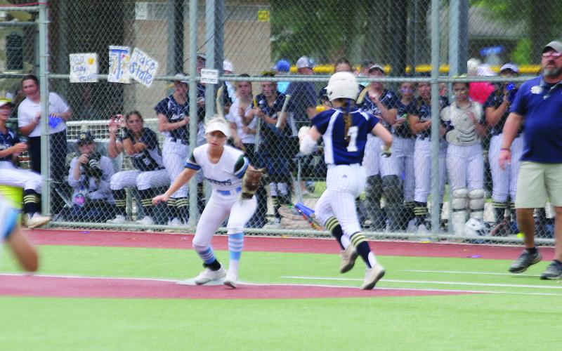 Sacred Heart’s Jacelyn Pitre (7) hustles down the first base line during the Lady Trojans’ 13-3 loss to district rival Catholic-Pointe Coupee in the state softball seminfinals at Sulphur. (Gazette photo by Rhett Manuel)
