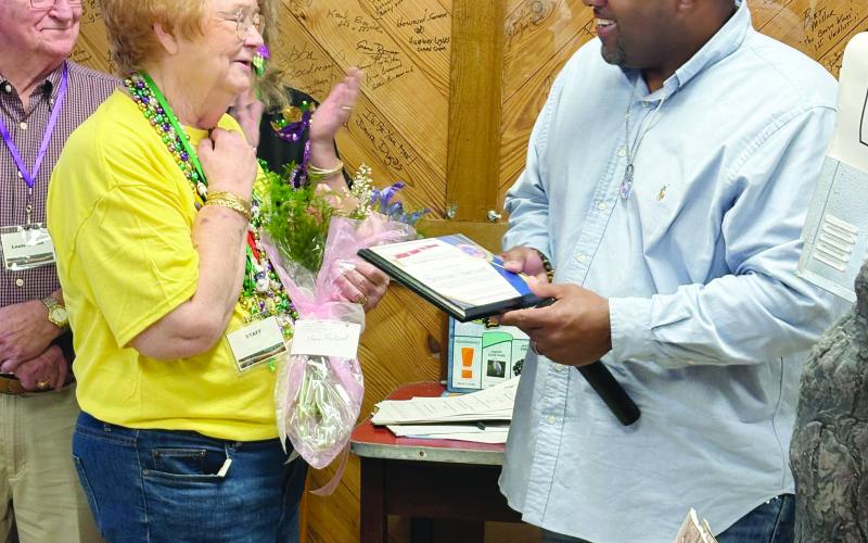 In the left photo is Ville Platte Mayor Ryan LeDay Williams (right) as he recognizes retired curator of the Louisiana Swamp Pop Museum, Sharon Fontenot (left), during a soiree held at the museum before the dance.
