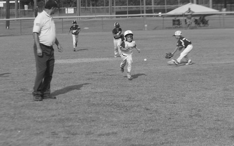 John Taylor Ardoin (8) hustles down to third base and eventually scores a run in Ville Platte West’s 25-24 loss to Oakdale American. (LSN photo by Tony Marks)