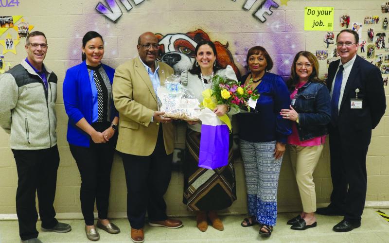 From left are Ville Platte Elementary Assistant Principal Davis Ardoin and Principal Katrina Ardoin, Superintendent Darwan Lazard, Louisiana Middle School Teacher of the Year Semifinalist Jessica Capseta, Teacher of the Year Coordinator Grace Sibley, Elementary Supervisor Cherie Fontenot, and Assistant Superintendent Mike Lombas. (Gazette photo by Tony Marks)