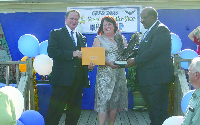 From left are Asst. Supt. Lombas, Elementary Teacher of the Year Bernice Ardoin from Pine Prairie High School, and Supt. Lazard. (Gazette photo by Tony Marks)