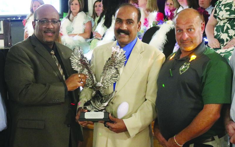 From left are Superintendent Darwan Lazard, Middle School Teacher of the Year Hari Krishna Prasad Oruganti, and Mamou High School Principal Doug Fontenot. (Gazette photo by Tony Marks)
