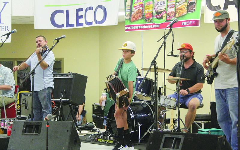 In the top photo, 10-year-old Cam Berzas (center) performs with Seth Spell and Cajun Strong after receiving the $500 scholarship from the Mamou Cajun Music Festival Association.
