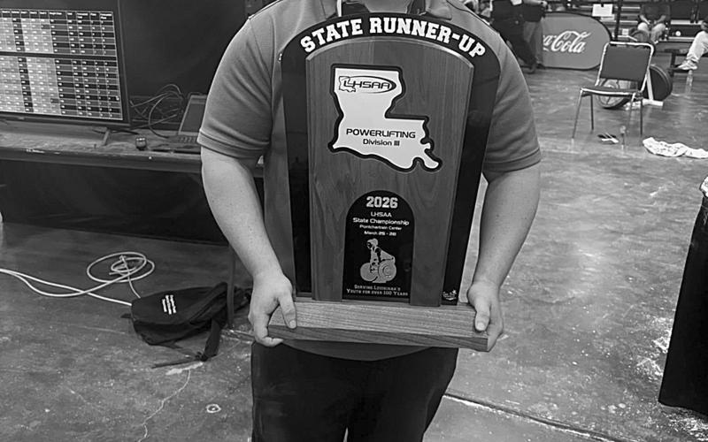 Mamou head powerlifting coach Kirk Taylor is pictured with this year’s girls’ state runner-up trophy. (Photo courtesy of Kirk Taylor)