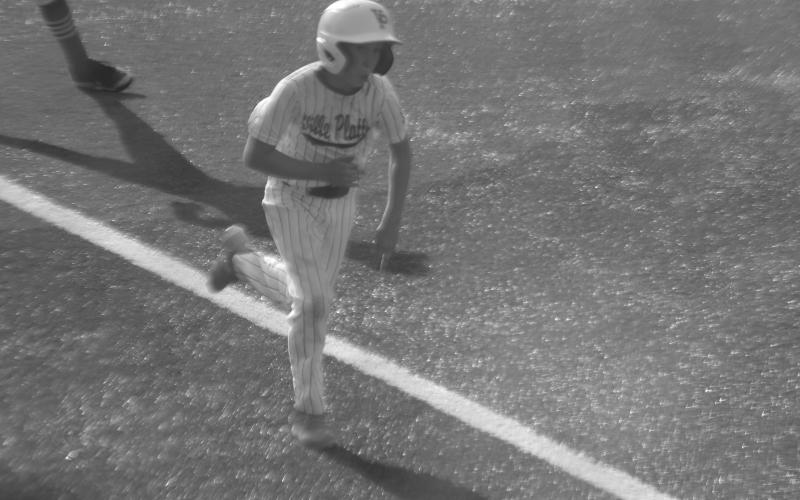 Aeden Guillory scores a run for Ville Platte in the 10-run fourth inning against West Carroll.