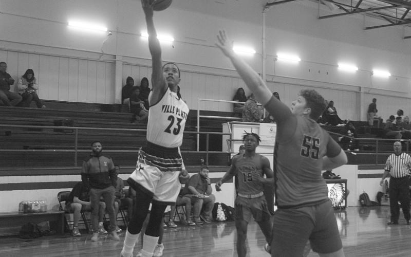 Sage Papillion (23) scores a basket against Tioga in a 68-49 win over the Indians to kick off the New Year’s Tip-Off Presented by RoyOMartin in Oakdale. (Gazette photo by Tony Marks)