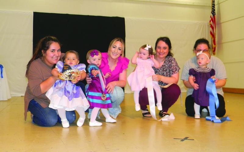 TODDLER MISS COURT - Shown, from left, are the members of the Toddler Miss Viande Boucanèe Court. They are Queen Penelope Mae Suydam; Josie James Fletcher, first runner-up; Jolie Herboldsheimer, second runner-up; and Willow Grace Miller, third runner-up.