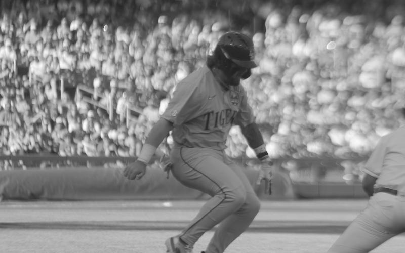 LSU’s Tommy White attempts to leg out an infield single in the Tigers’ loss to Wake Forest on Monday. White, in a rematch against the Demon Deacons, delivered a home run to send his team to the best-of-three finals. (LSN photo by Tony Marks)