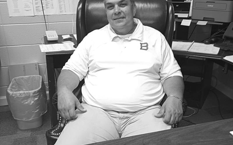 Tony Bertrand takes back his seat in the principal’s office at Basile High School. (LSN photo by Darrel LeJeune)