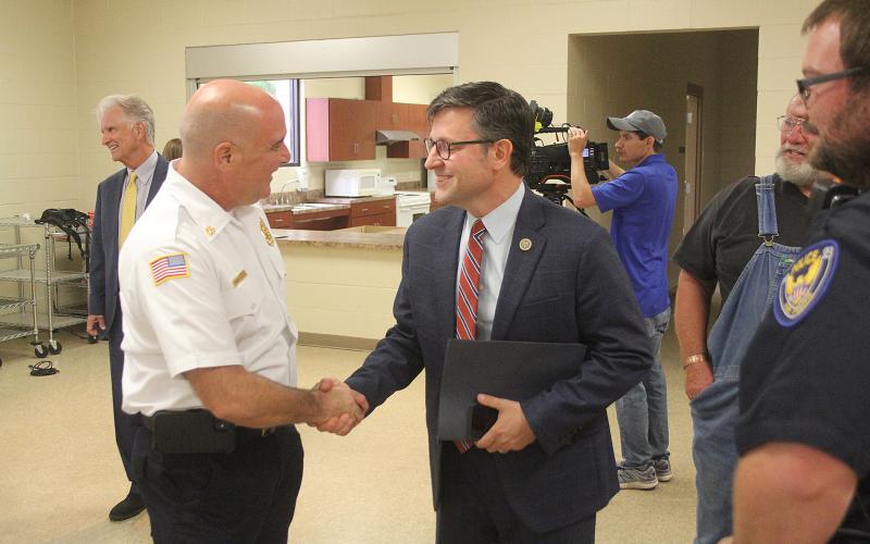 Congressman Johnson greets Ville Platte Fire Chief Chris Soileau.