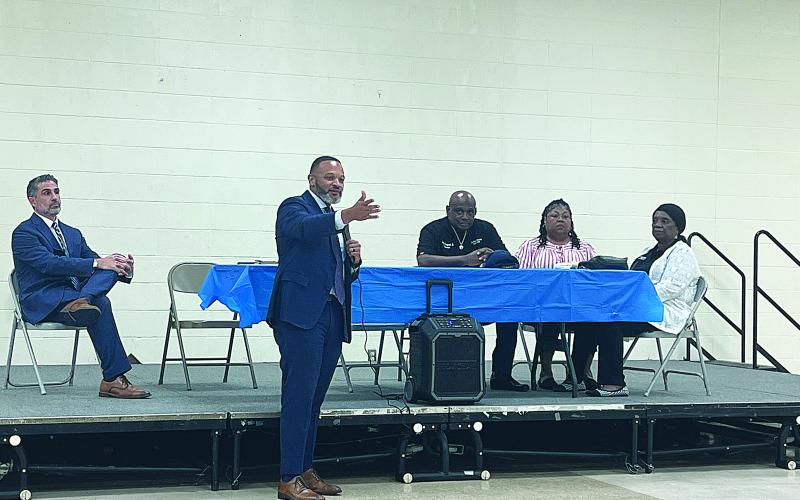 United States Attorney for the Western District of Louisiana Brandon Brown (standing) is pictured as he speaks to a gathering of law enforcement personnel and other community leaders at the Martin Luther King Center. Seated from left are Myers Namie with the US Attorney’s Office, Ville Platte Housing Authority Chair Arthur Sampson, Ville Platte Housing Authority Vice Chair Wanda Skinner, and Ville Platte Housing Authority Acting Executive Director Sheila Ben. (Gazette photo by Tony Marks)