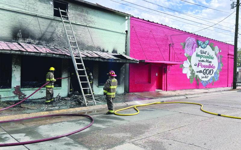 Members of the Ville Platte Fire Department work to finish as they extinguish a commercial structure fire on Friday, March 6. (Gazette photo by Nancy Duplechain)